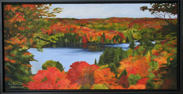 'The Retreat' Features a view of fall foliage overlooking a lake vibrant reds,oranges,and touches of green by Brenda Stonehouse KAwartha Lakes Artist 